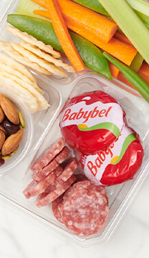 Babybel snack pack with veggies, cracker, meat and nuts