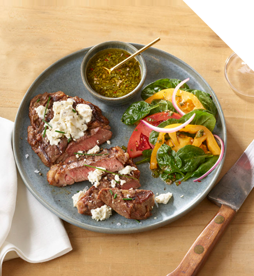 Steak dinner with Boursin cheese topping