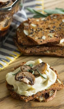 Bread slices with cheese spread and mushrooms