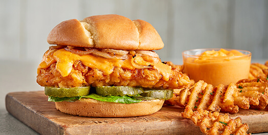 Fried chicken sandwich with Merkts Cheese Spread and waffle fries